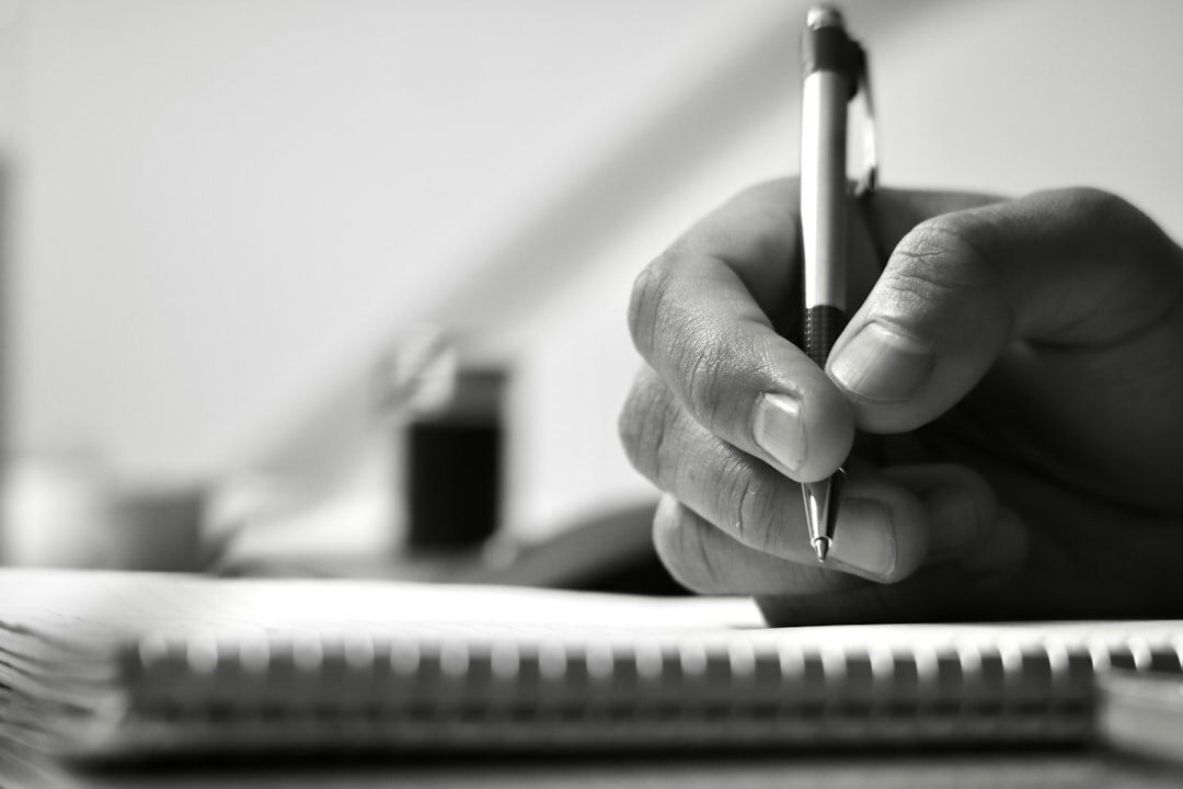 Hand holding a pen over an inheritance planning checklist
