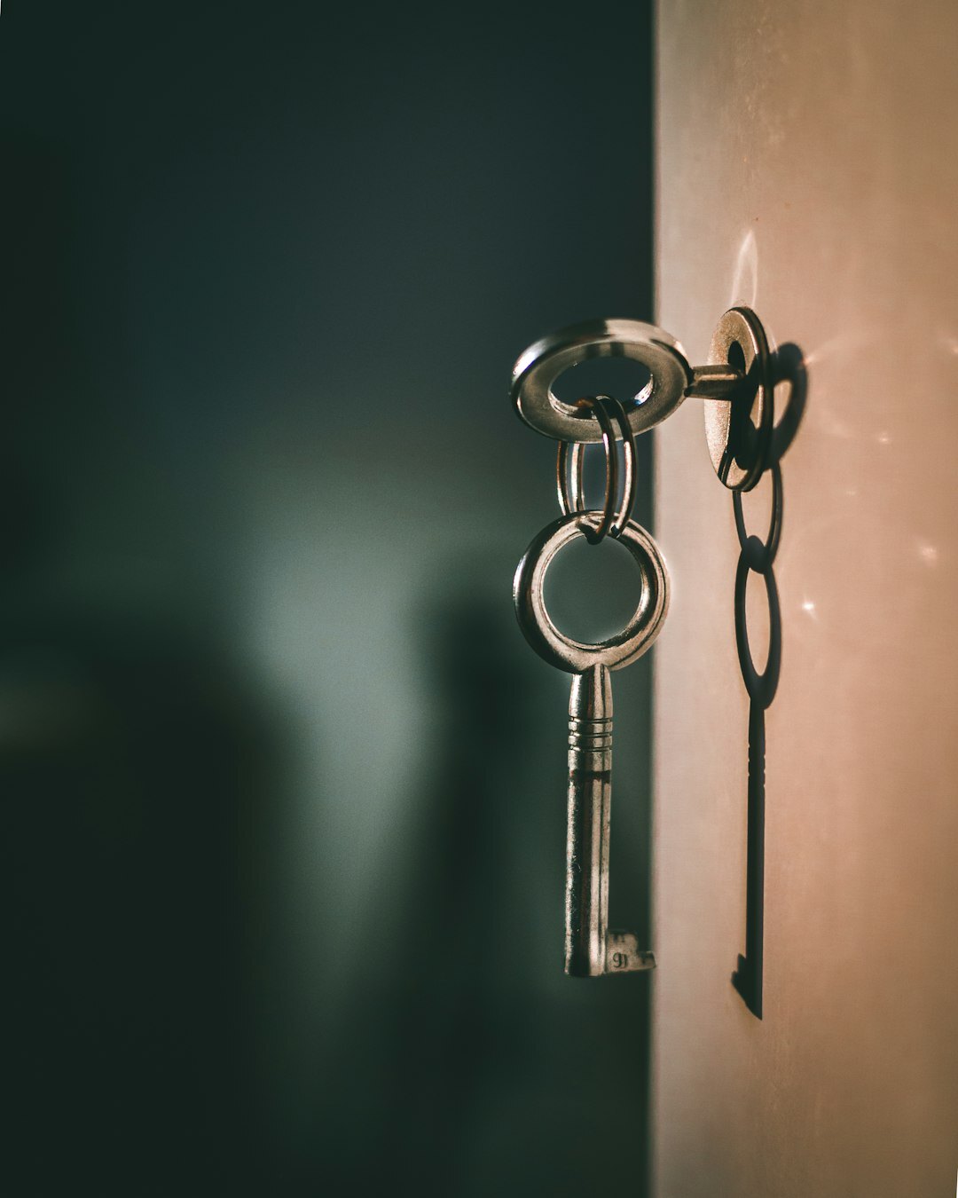 House keys resting on a property ownership contract